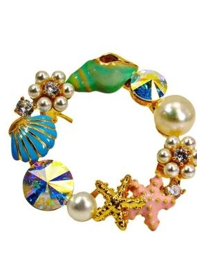 Ocean theme pin brooch made with sea shells, starfish, pearls, and crystals New